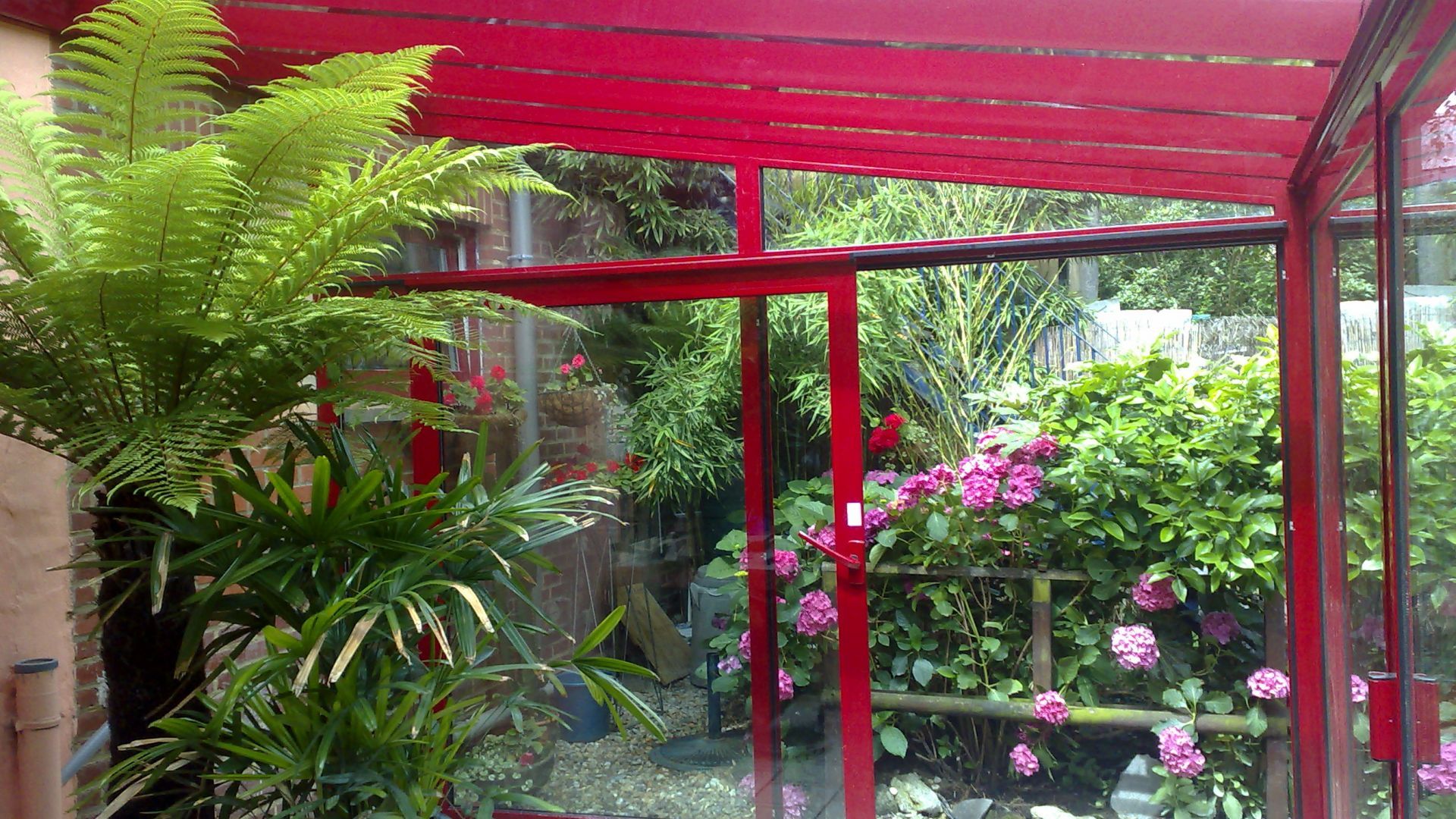 Véranda en aluminium finition rouge haute qualité